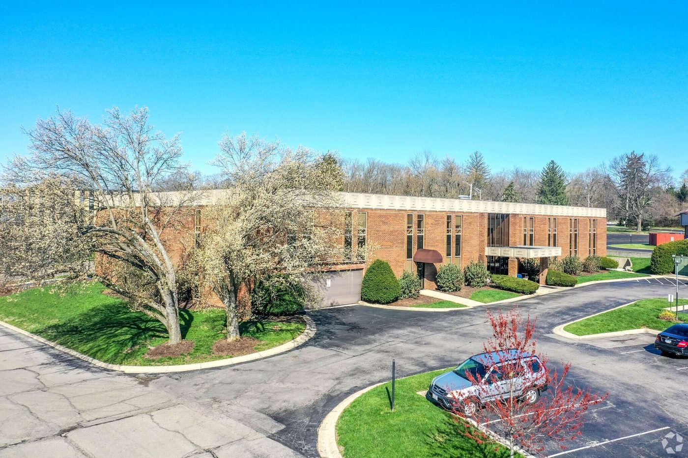 Back of the building showing the parking lot and entrance